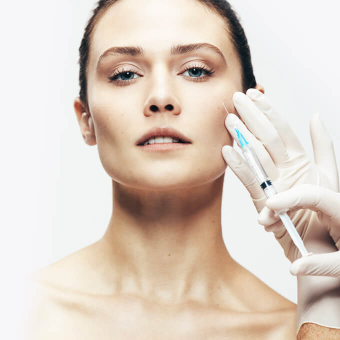 Female receiving facial aesthetic injections. Female receiving facial aesthetic injections.